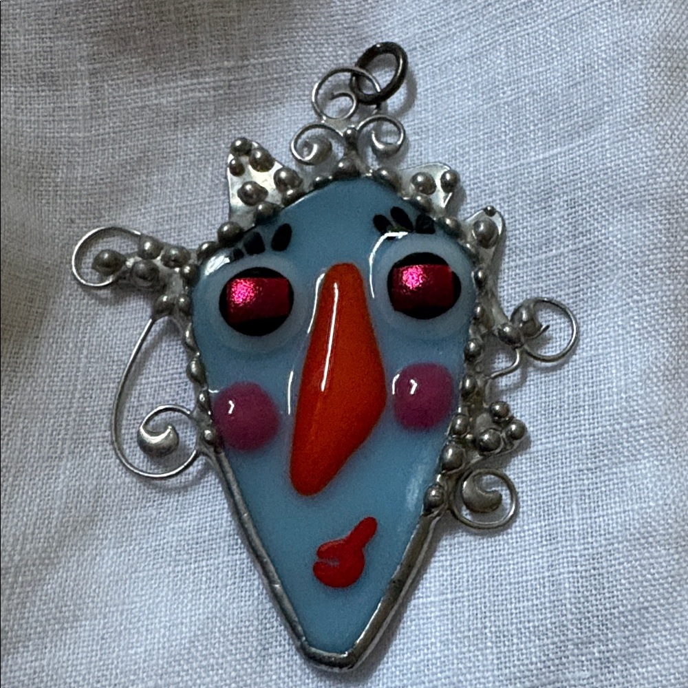 Handmade Enamel Face Pendant Could be used as a necklace or window hanging .